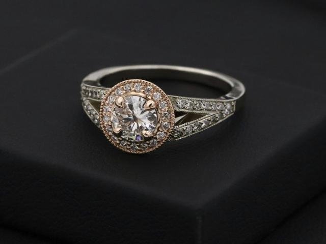 A solitaire diamond ring on a presentation box