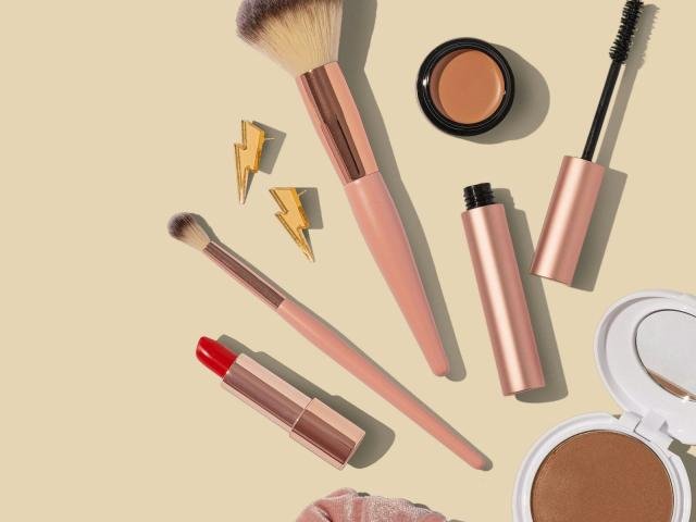 Beauty and makeup essentials arranged on a flat surface