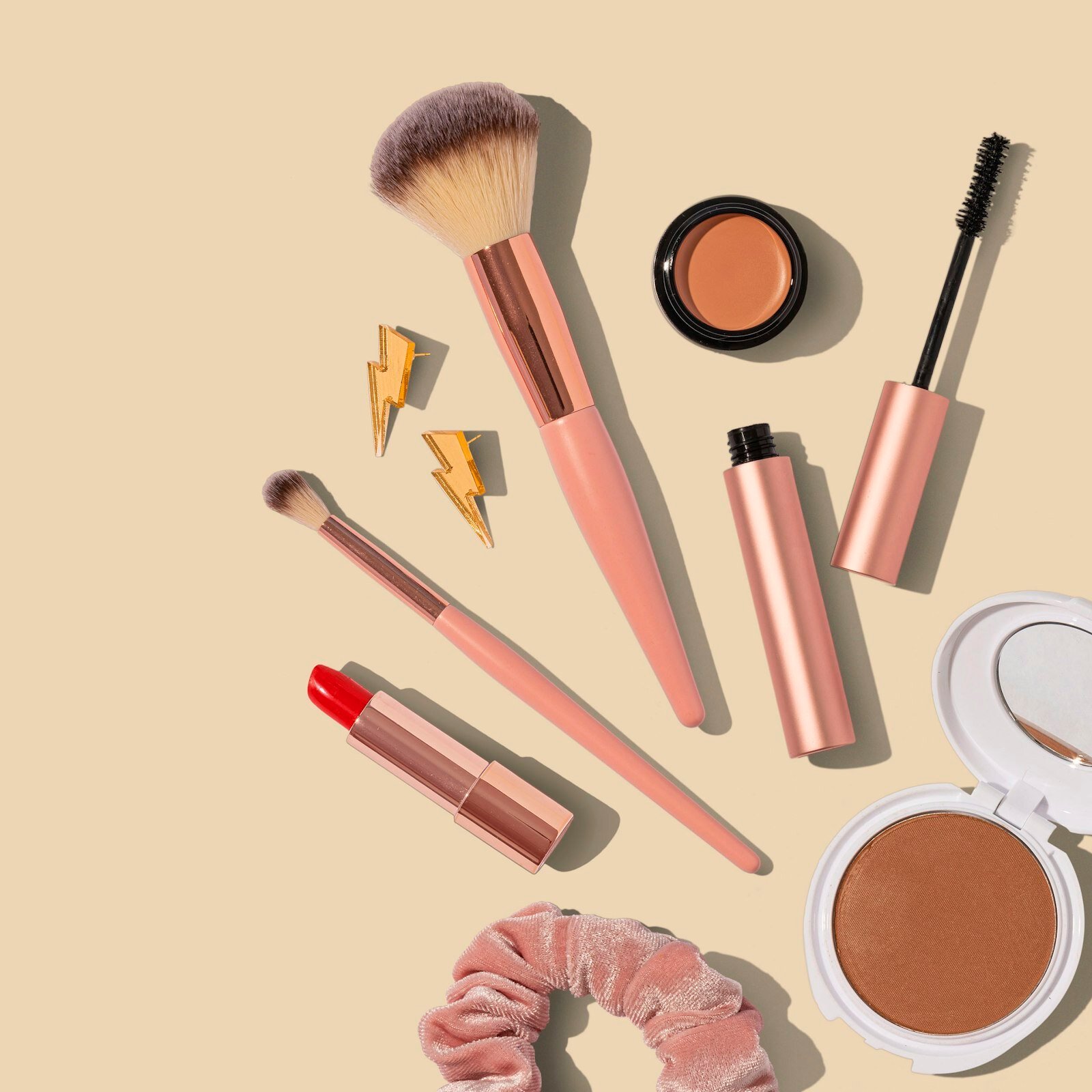 Beauty and makeup essentials arranged on a flat surface